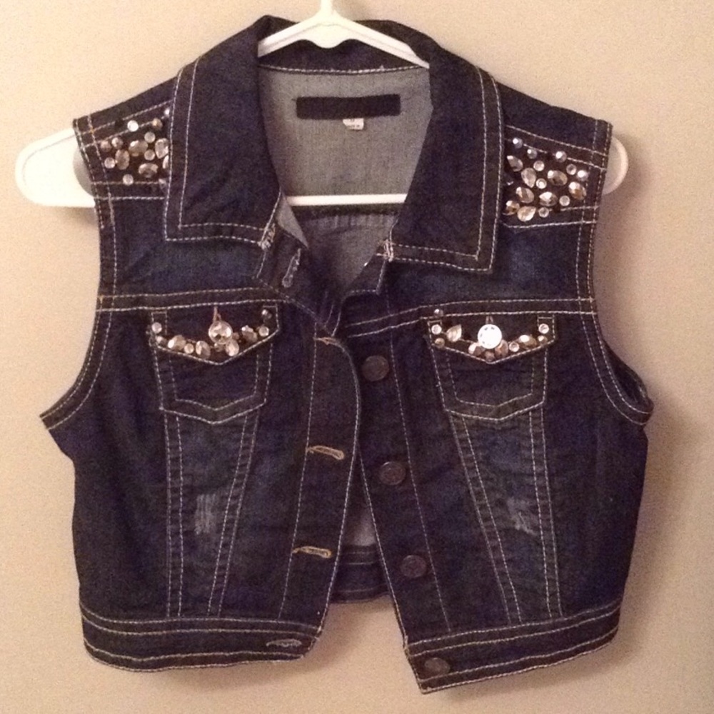 Wall flower Sleeveless rhinestone jean jacket.